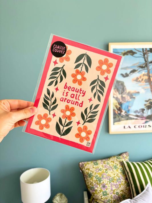 Affiche murale colorée avec des fleurs et un message positif "Beauty is all around".