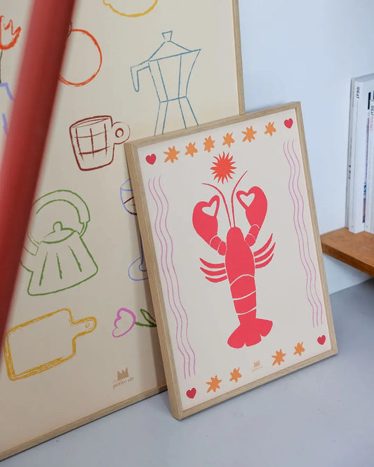 Affiche murale décorative avec un homard et des étoiles, posée au sol.