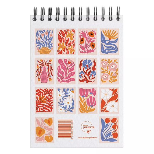 Carnet de coloriages pour adultes avec des fleurs colorées.