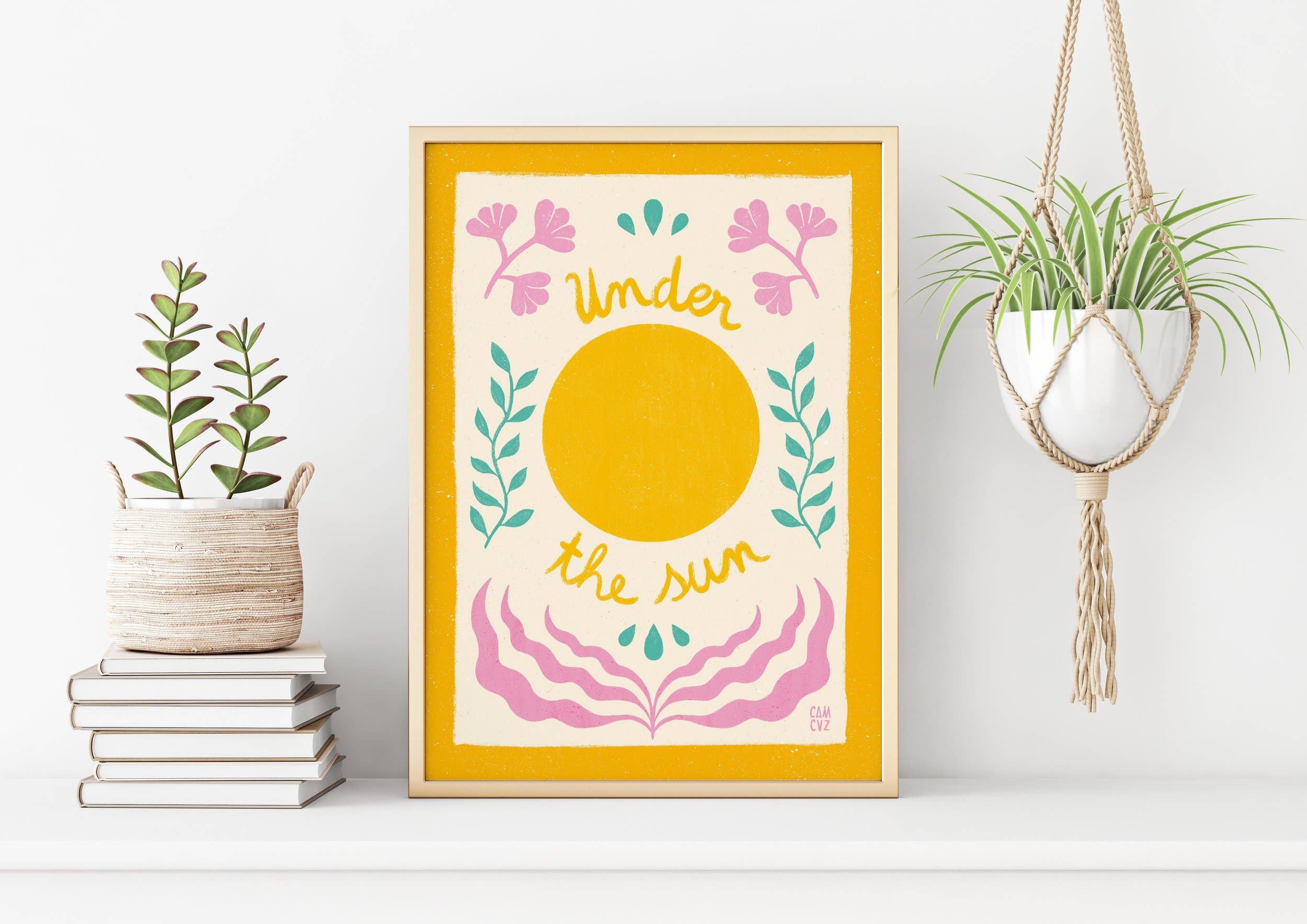Affiche murale colorée avec des fleurs, un soleil, et un message positif, dans un cadre blanc.