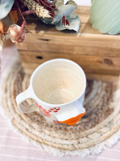 tasse/mug artisanal en céramique fabriqué en france, bouche orange flashy, fleurs colorés, orange, rose et jaune avec une anse