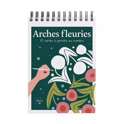Carnet de peinture aux numéros avec des arches fleuries.