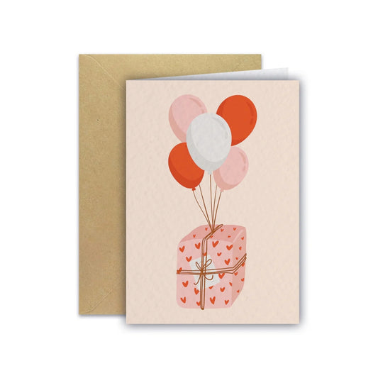 Carte d'anniversaire avec un cadeau et des ballons, Maison Joliette.