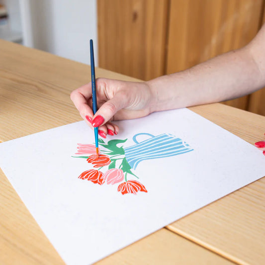 Kit peinture aux numéros avec deux illustrations, deux pinceaux et des pots de peinture, salut irène.
